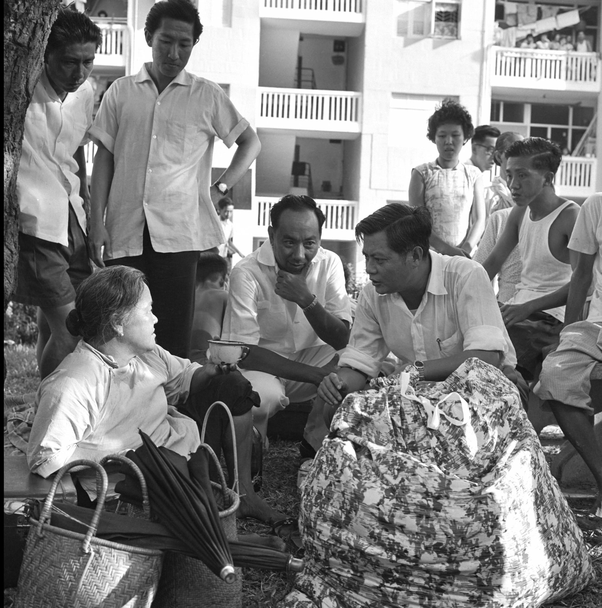 Goh Keng Swee and Lin You Eng touring the fire-ravaged Kampong Tiong Bahru area immediately after the disaster in 1961. The Straits Times/The New Paper © Singapore Press Holdings Ltd. Reprinted with permission.